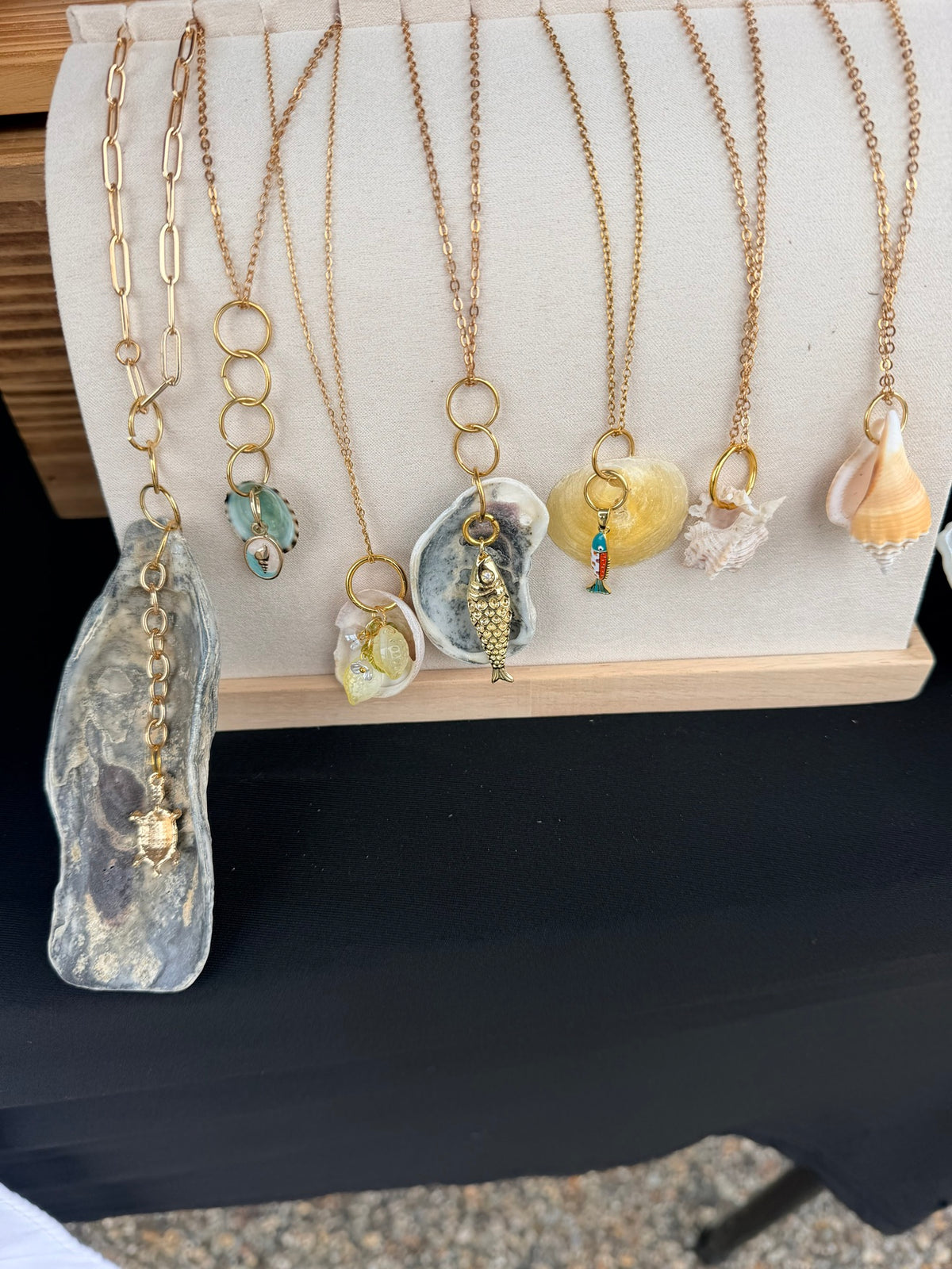 Seven shell necklaces on display