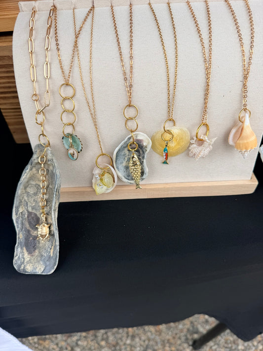 Seven shell necklaces on display